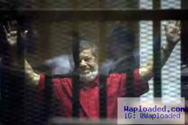 Egyptian court sentences former President Morsi to life in prison and 2 Aljazeera journalists, female reporter, to death